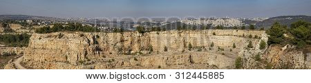 A Desrted Quary Near Jerusalem, Israel. Nature Slowly Reclaims The Place, Pine Trees And Vegetation 