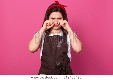 Disappointed Upset Housewife Touching Her Face With Hands, Wiping Tears Out, Crying, Wearing Brown A