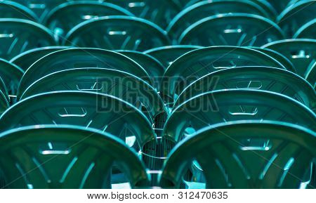 Bucharest, Romania - June 23, 2019: Green Plastic Chairs Are Placed In Izvor Park For Spectators Who