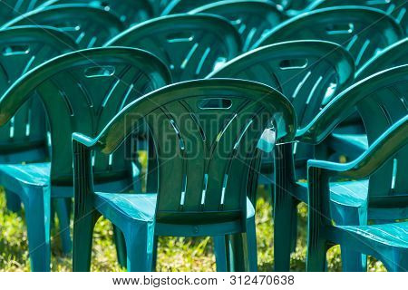 Bucharest, Romania - June 23, 2019: Green Plastic Chairs Are Placed In Izvor Park For Spectators Who