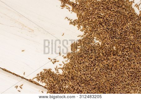 Lot Of Whole Dry Caraway Fruits Copyspace Left Side Flatlay On White Wood