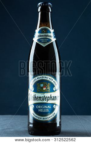 Khabarovsk, Russia - Jul 21, 2018: Beer Bottle Weihenstephan And A Glass Of Beer On Table On Blue Ba