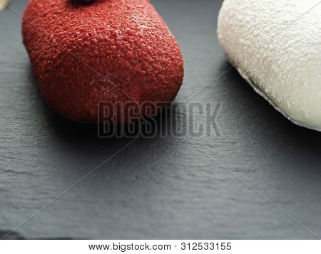 Selection Of Red White Dessert Pastry Sweet Mini Cakes On Slate . Copy Spece