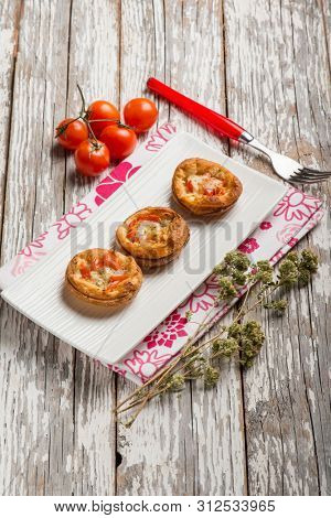 mini pizzas with tomatoes mozzarella and oregano