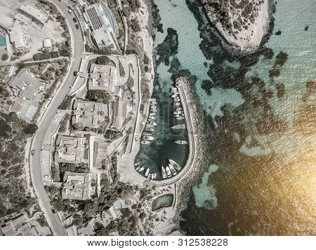 Beautiful birdeye view on the sea coastline with pier and yakhts at sunny day. Travell, jorney,islands, Seascape, freedom, holidays concept.