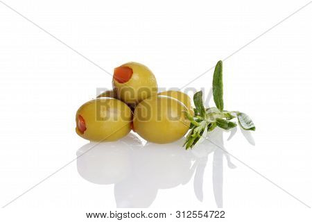 Pile Of Pimento Green Olives With Fresh Rosemary Herb