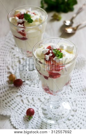 Eton Mess, Traditional English Dessert With Gooseberry, Whipped Cream And Meringue On A Light Backgr