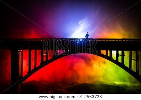Artwork Decoration. Silhouette Of Powerful Metallic Bridge At Night With Foggy Backlight. Silhouette