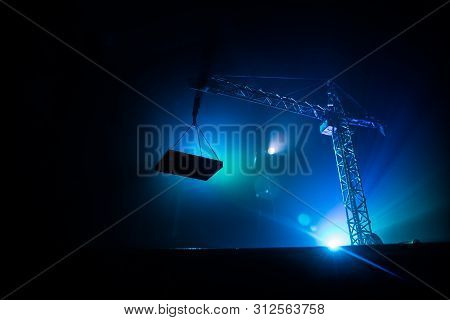 Abstract Industrial Background With Construction Crane Silhouette Over Amazing Sunset Sky. Tower Cra