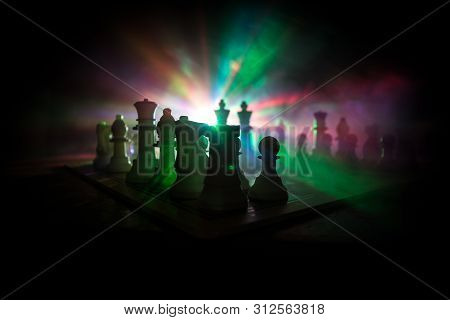 Chess Board Game Concept Of Business Ideas And Competition. Chess Figures On A Dark Background With