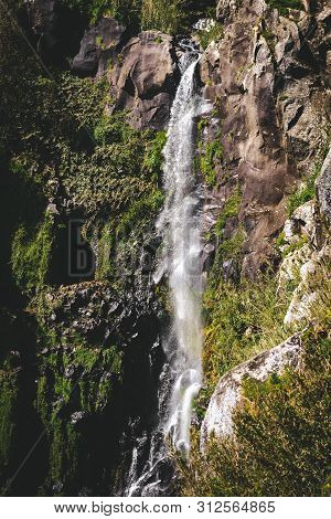 View Towards Waterfall In Nordeste Near Lighthouse Ponta Do Arnel In Sao Miguel Island, Azores