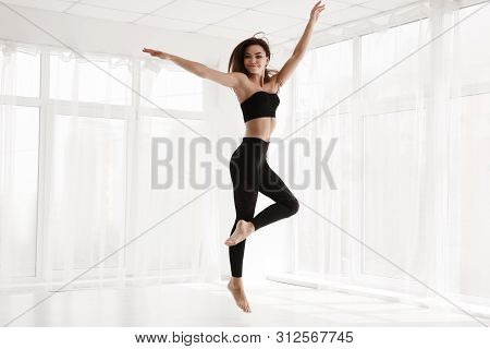 Beautiful Contemp Dancer In Modern White Studio. Graceful Woman Dancing Contemporary Ballet. Copy Sp