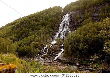 Ryfylke Waterfall At Svandalsfossen In Norway, Powerful Waterfall In Norwegian Mountains. National T