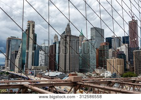 New York, Usa - June 21, 2019:  Manhattan Through The Brooklyn Bridge Metal Ropes.