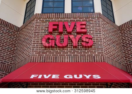 Maple Grove, Minnesota - July 21, 2019:  Exterior Of A Five Guys Fast Food Restaraunt, Close Up Of T