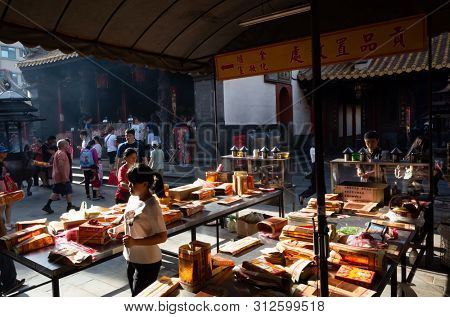 Yunlin, Taiwan - July 13th, 2019: chinese joss gold paper craft on a table at Beigang Chaotian Temple, Yunlin, Taiwan, Asia