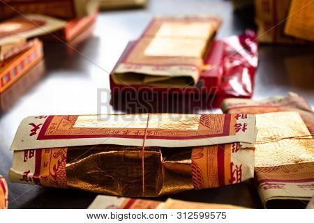 Yunlin, Taiwan - July 13th, 2019: chinese joss gold paper craft on a table at Beigang Chaotian Temple, Yunlin, Taiwan, Asia