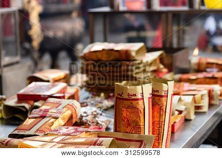 Yunlin, Taiwan - July 13th, 2019: chinese joss gold paper craft on a table at Beigang Chaotian Temple, Yunlin, Taiwan, Asia