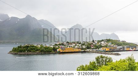 Husoy Island Village Panorama With Mountains In The Background, Senja Island, Troms County, Norway
