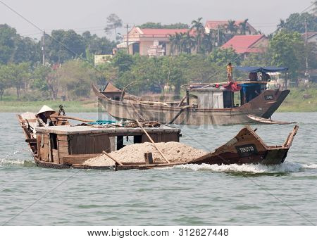 Workboats On The Perfumed River In Hue, Vietnam