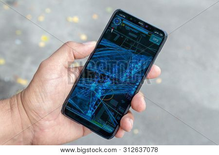 Lutsk, Ukraine - 14 Jun 2019: Player Hand With Phone Showing Augmented Reality Game Called Ingress. 