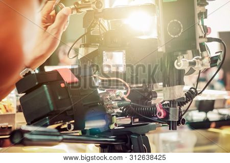 Behind The Scene. Cameraman Shooting Film Scene With Camera
