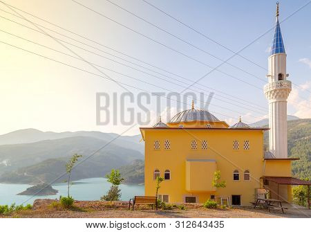 Mosque On The Mountain Range Hill Top. Muslim Background With Copy Space For Ramazan Or Ramadan Gree