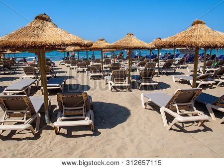 Malia, Crete, Greece - Juni 18, 2019: Sunbeds At The Beach In Malia On Crete, Greece