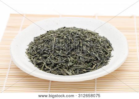 Japanese Dried Tea Leaves On Plate, On White Background
