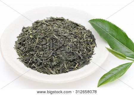 Dried Tea Leaves With Green Tea Leaves On White Background
