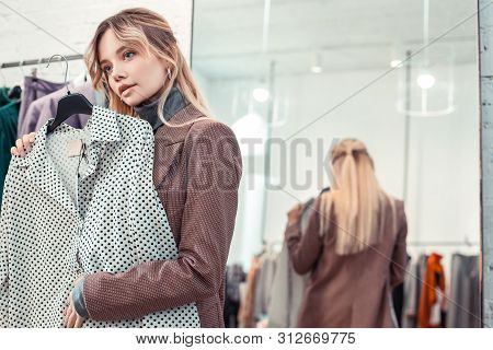 Appealing Young Woman Feeling Good While Shopping After Work