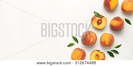 Flat Lay Composition With Peaches. Ripe Juicy Peaches With Green Leaves On White Background. Flat La