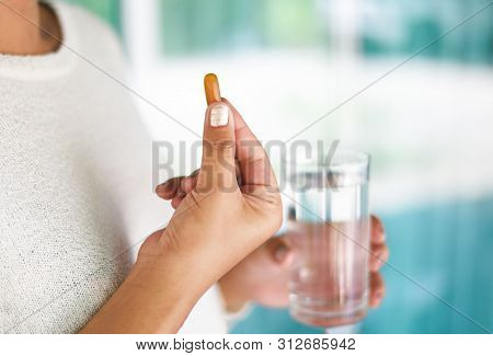 Take A Medicine Health Care And People Concept / Woman Holding Pill Capsule Supplementary Food And T
