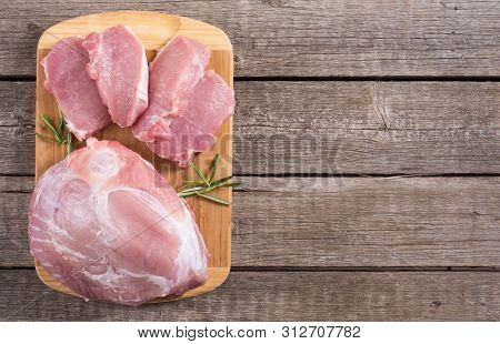 Raw Pork Meat On Wooden Background