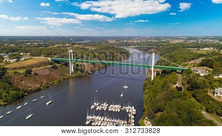 Aerial Photo Of La Roche Bernard Suspension Bridge And Marina, In The Morbihan, France