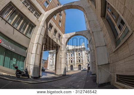 Milan, Italy - June 29, 2019: One Street Entrance Of The Piazza Degli Affari With The Palazzo Mezzan
