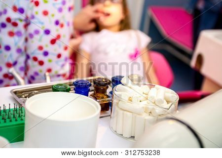 Set Of Dentist Tools And Equipment On Clinic Desktop