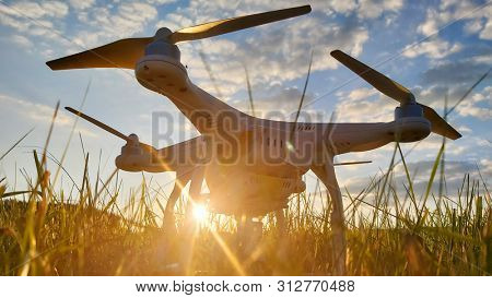 Pilsen / Czech Republic - June 16, 2019: Drone quadrocopter Dji Phantom 3 Professional with camera preparing to start. Take off for monitoring private property. UAV working in agriculture.