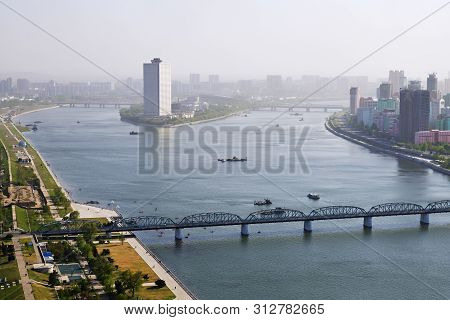 Pyongyang, North Korea - May 1, 2019: City View And Taedong River At Sunset. View On The Modern Yang