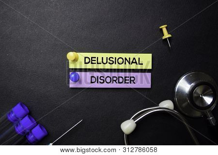 Delusional Disorder Text On Sticky Notes. Top View Isolated On Black Background. Healthcare/medical 