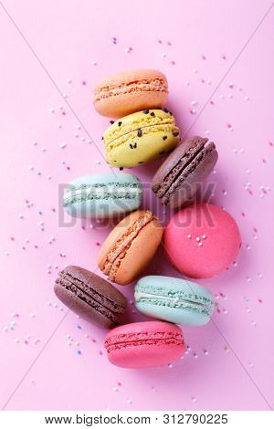Colorful French Macarons On Pink Background With Copy Space, Traditioanal Dessert In France