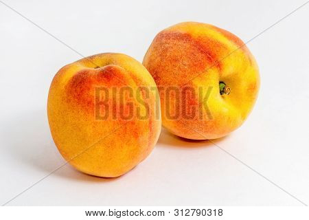Two Juicy Peaches. Summer Fruits. Harvest On The Farm. Delicious Igridient For Juice. White Backgrou