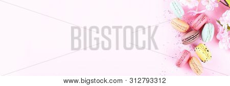 Colorful French Macarons On Pink Background With Copy Space, Traditioanal Dessert In France
