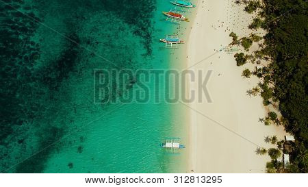 Aerial Seascape: Tropical Beach With Palm Trees And Turquoise Waters Of The Coral Reef, From Above, 