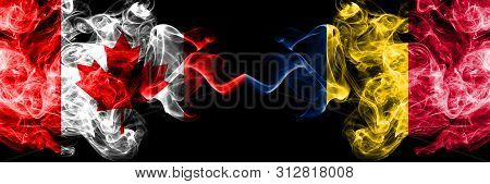 Canada Vs Chad, Chadian Smoky Mystic Flags Placed Side By Side. Thick Colored Silky Smoke Flags Of C