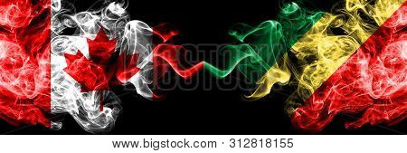 Canada Vs Congo, Congolese Smoky Mystic Flags Placed Side By Side. Thick Colored Silky Smoke Flags O