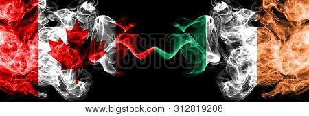 Canada Vs Ireland, Irish Smoky Mystic Flags Placed Side By Side. Thick Colored Silky Smoke Flags Of 
