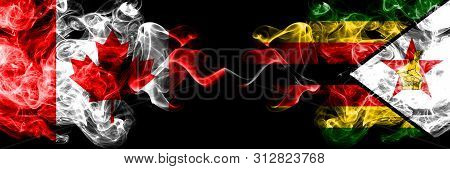 Canada Vs Zimbabwe, Zimbabwean Smoky Mystic Flags Placed Side By Side. Thick Colored Silky Smoke Fla