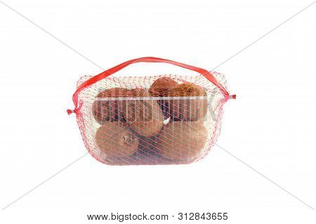 Kiwi In A Plastic Tray In The Grid. Packaging For Sale. White Isolate