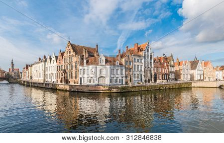 Medieval Buildings Along A Spiegelrei Canal In Bruges, Belgium